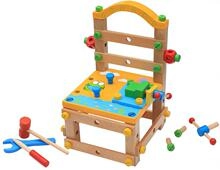 Detail of colorful wooden assembly chair toy with nuts, bolts, and tool accessories