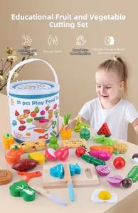 Little girl playing with 31pcs wooden magnetic fruit and vegetable kitchen toy set