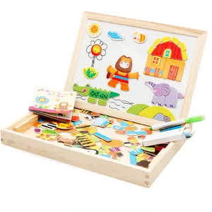 Detail of wooden magnetic puzzle set with forest animal pieces and a white drawing board