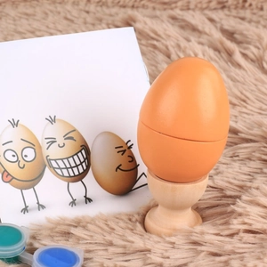 Realistic wooden toy egg with orange finish, paint set, and base for DIY creative play