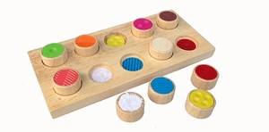 Detail view of colorful tactile wooden puzzle pieces with various textures and colors