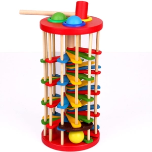 Detail of wooden ball drop tower showing spiral ladder and mallet for toddlers