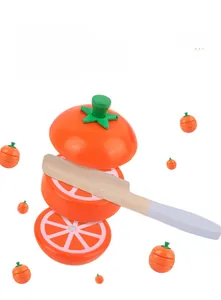 Macro detail of wooden toy tomato with magnetic slicing design and small wooden knife