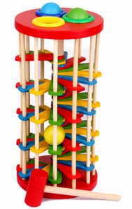 Detailed view of the wooden ball drop tower with colorful spiral steps and a wooden hammer