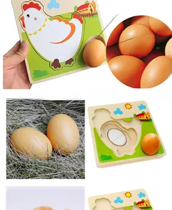 Detail of wooden hen growth puzzle featuring a realistic egg slot and smooth timber finish