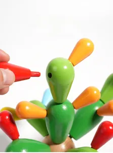 Close-up of hands assembling colorful wooden cactus blocks for creative educational play