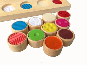 Close-up of wooden sensory toy blocks with diverse textures and bright colors for toddlers
