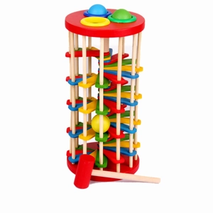 Detail of wooden ball drop ladder toy with colorful spiral stairs and a red mallet