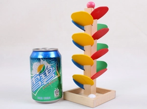 Detailed size comparison of a colorful wooden ball tower toy with a 330ml soda can