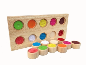 Macro detail of Montessori sensory touch match toy with various textures and colors