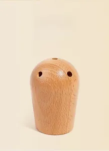 Detail of eco-friendly wooden building blocks with polished finish and three precise holes