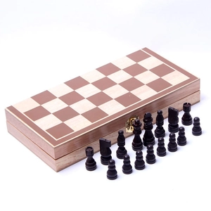 Close-up of a foldable wooden chess board with high-quality dark brown chess pieces