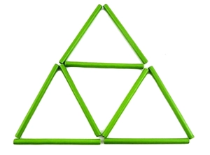 Detailed view of green bamboo counting sticks arranged in a geometric triangle shape