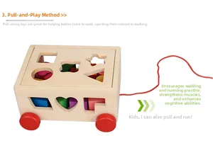 Detail of wooden pull-along shape sorter car with colorful geometric blocks for toddlers