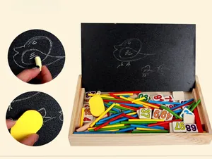 Detail view of wooden educational math set with colored counting sticks and chalkboard