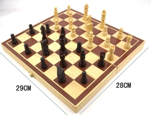 Top view of a foldable wooden chess set showing 29cm x 28cm unfolded dimensions