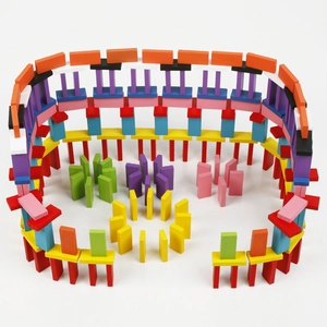 Colorful wooden domino blocks set arranged in creative arena patterns for kids