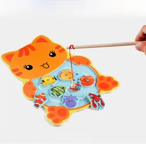 Macro shot of a child using the magnetic wooden cat fishing toy with colorful sea animals