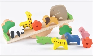 Close-up of wooden animal blocks with forest trees and solid wood balance base