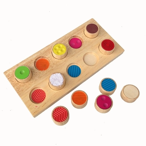 Wooden sensory puzzle for kids with colored blocks and tactile textures on a white background