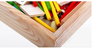 Close-up of wooden math learning box with colorful counting sticks and number cards
