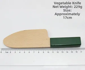 Detail view of wooden play kitchen knife toy with green handle, 17cm length and 22g weight