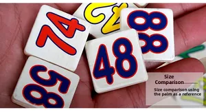Close-up of colorful wooden math blocks held in hand for educational counting games