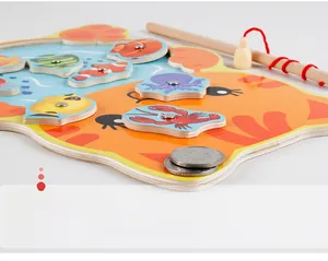 Detail of magnetic wooden toy fish with smooth polished edges and colorful sea creatures
