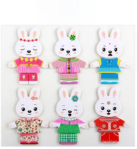 Detail of wooden rabbit dress-up puzzle set with various outfits and expressions