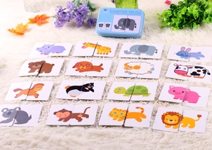 Educational animal cognition puzzle set with blue tin box on white plush rug background