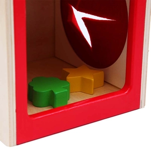 Dettaglio macro della scatola montessoriana in legno con blocchi colorati