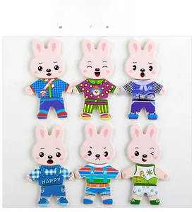 Close-up of wooden rabbit dress-up puzzle with interchangeable expressions and clothing sets