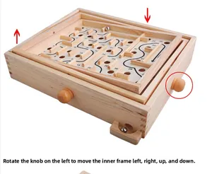 Detail of wooden labyrinth game box showing control knobs and numbered maze paths