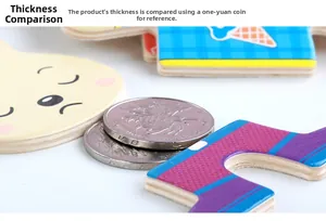 Detail view of thick wooden rabbit puzzle piece compared to two stacked metal coins