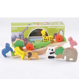 Wooden forest animal seesaw balancing toy with colorful stacking blocks on white background