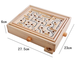 Close-up of wooden balance board maze with metal ball and dual-axis control knobs