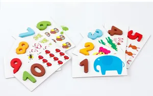 Macro detail of wooden number blocks and matching animal illustration cards for kids
