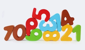 Colorful wooden number blocks for early math learning stacked on a white background