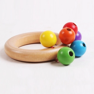 Rainbow wooden hand rattle for infants featuring six colorful beads on a natural wood ring
