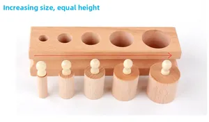 Detail of Montessori beechwood socket cylinder with increasing size and equal height