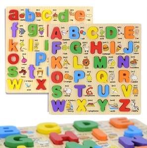 Close-up of wooden alphabet puzzle board showing colorful letters and animal patterns