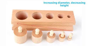 Macro shot of Montessori wooden cylinder sockets showing descending height and diameter size