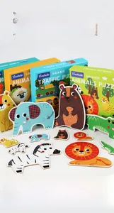 Close-up of thick cardboard puzzle pieces with colorful forest and animal illustrations