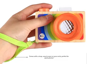 Detail of wooden toy camera with rainbow colors and multi-prism kaleidoscope lens