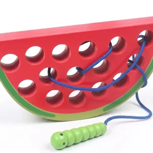 Educational wooden watermelon threading toy with green worm needle and blue string