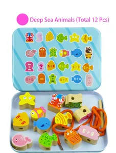 Detail of wooden sea animal beads with addition math patterns and orange threading string