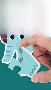 Close-up of easy-to-grip large puzzle pieces featuring a cute blue elephant design