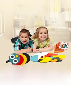 Children playing with wooden geometric puzzle blocks and animal pattern cards on the floor