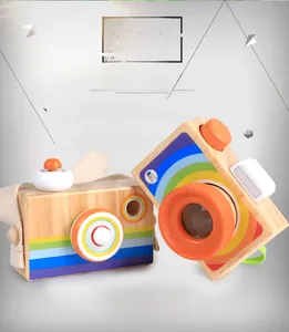 Detailed view of two eco-friendly wooden toy cameras with rainbow stripes and cotton lanyards