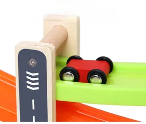Close-up of wooden car track showing smooth finish and racing car detail
